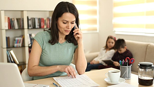 woman with her children working from home